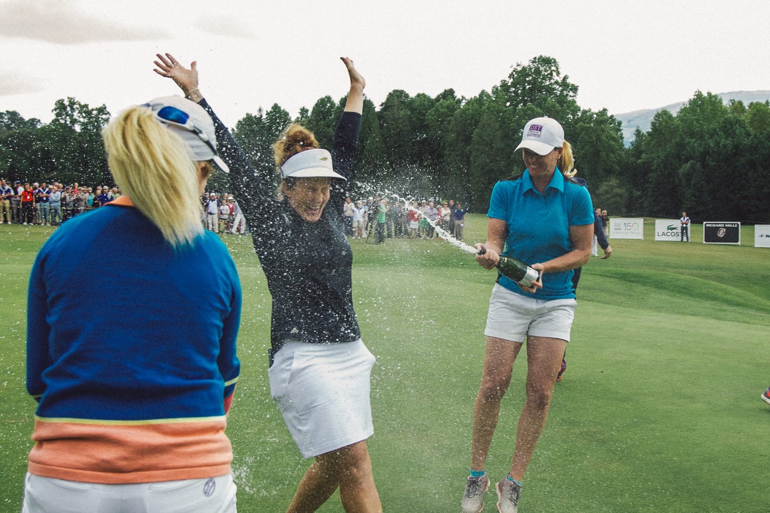 Beth Allen of the USA is sprayed with champagne